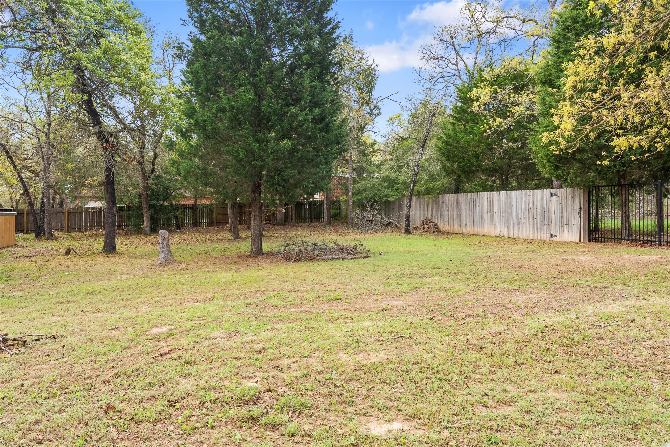 330 Arbors Circle Elgin, TX 78621 - Photo 30 of 37 View of yard with a fenced backyard