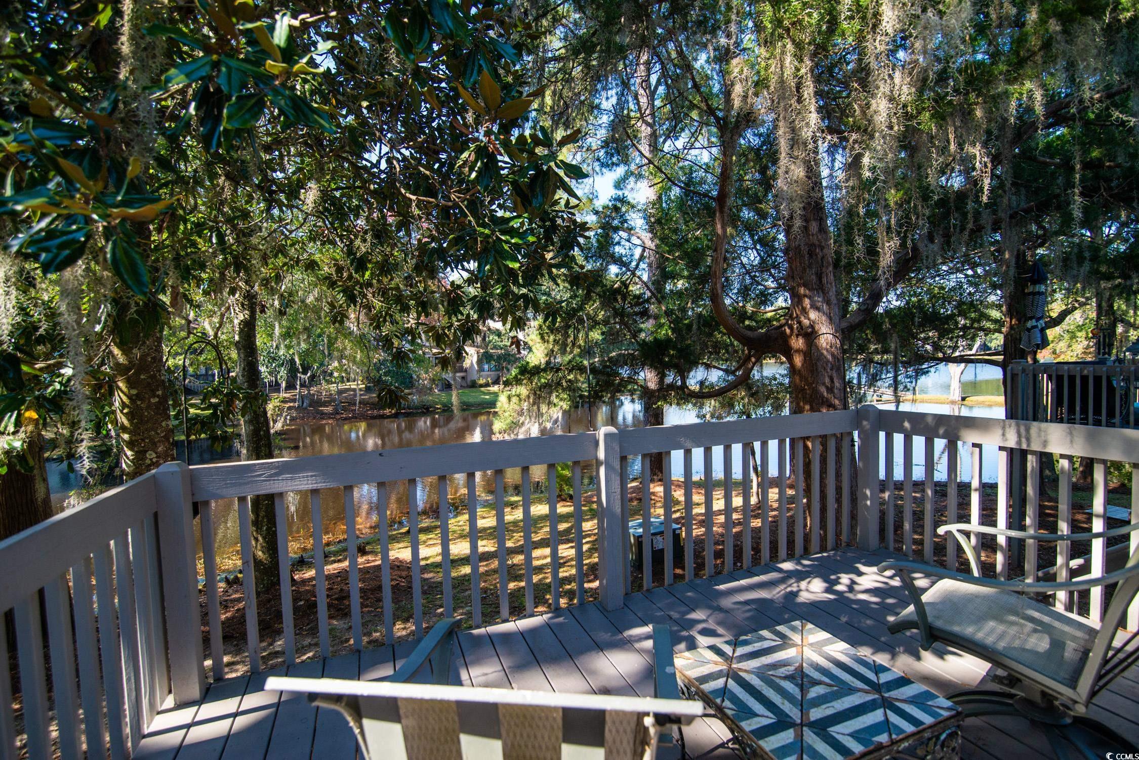 63 Battery White Court, Unit 2C Georgetown, SC 29440 - Photo 17 of 38 Wooden terrace with a water view