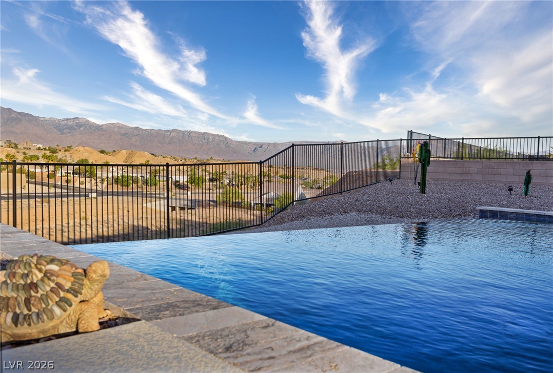 1460 Blue Ridge Trail Mesquite, NV 89027 - Photo 30 of 39 An infinity-edge pool creates a serene oasis with commanding mountain and desert views.