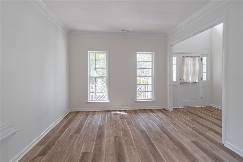 1324 Crescentwood Lane Decatur, GA 30032 - Photo 13 of 58 an empty room with wooden floor and windows