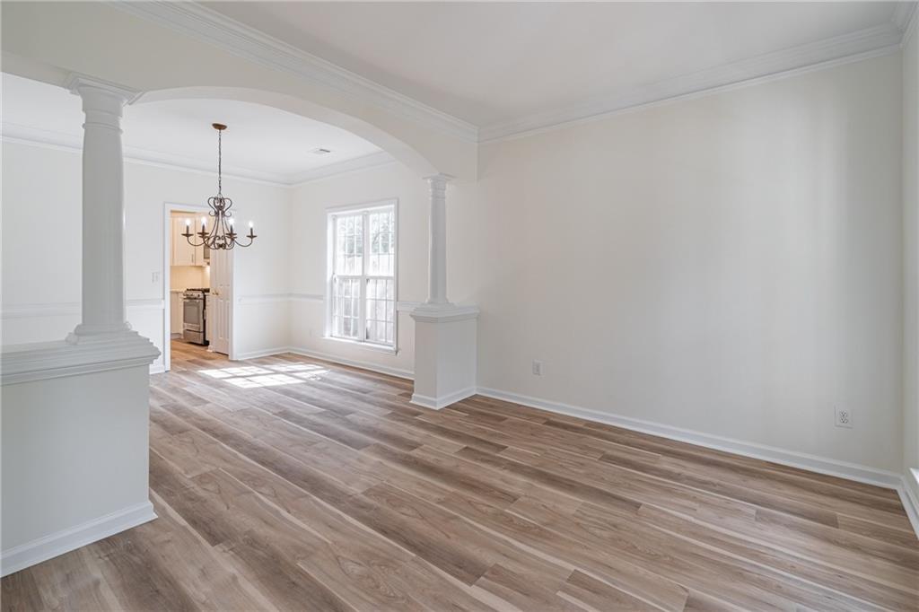 1324 Crescentwood Lane Decatur, GA 30032 - Photo 17 of 58 a view of empty room with wooden floor and fan