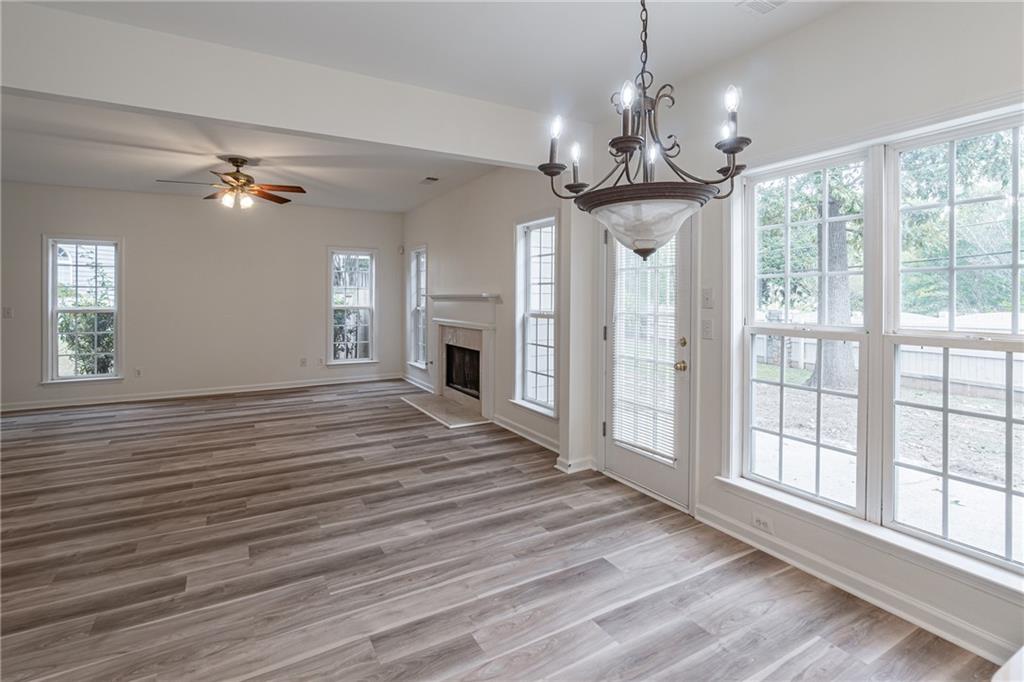1324 Crescentwood Lane Decatur, GA 30032 - Photo 25 of 58 a view of an empty room with chandelier and wooden floor