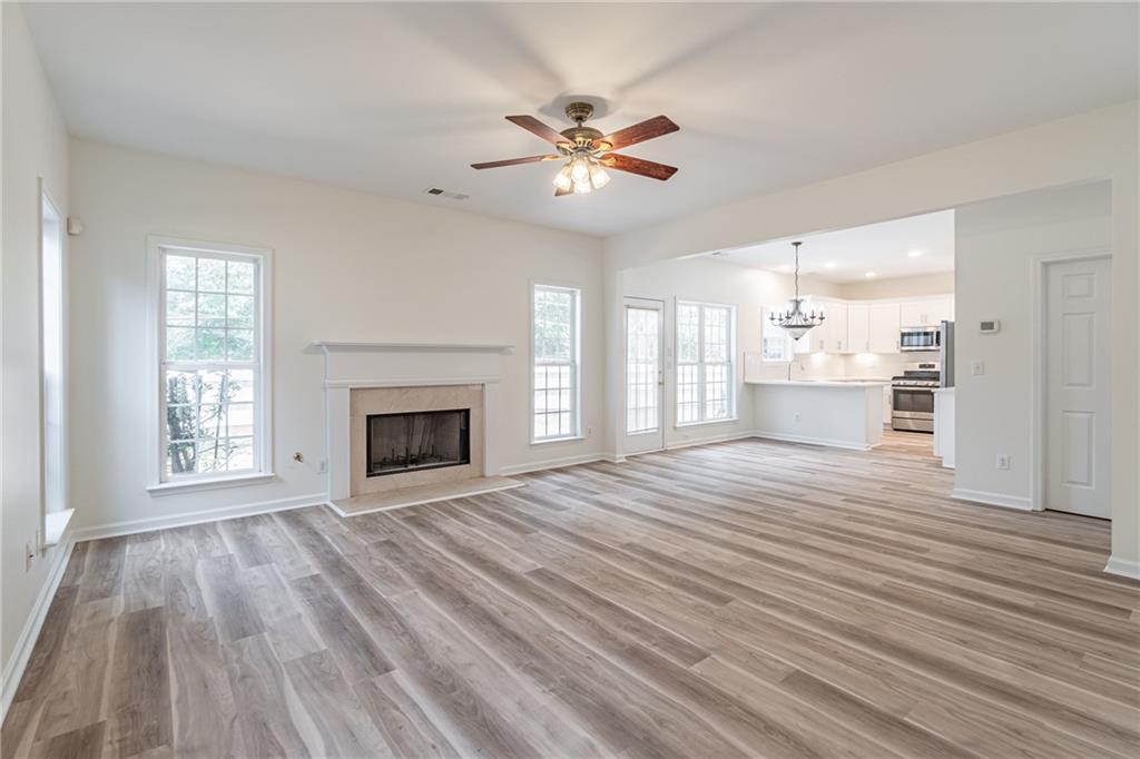 1324 Crescentwood Lane Decatur, GA 30032 - Photo 27 of 58 a view of an empty room with a fireplace and a window