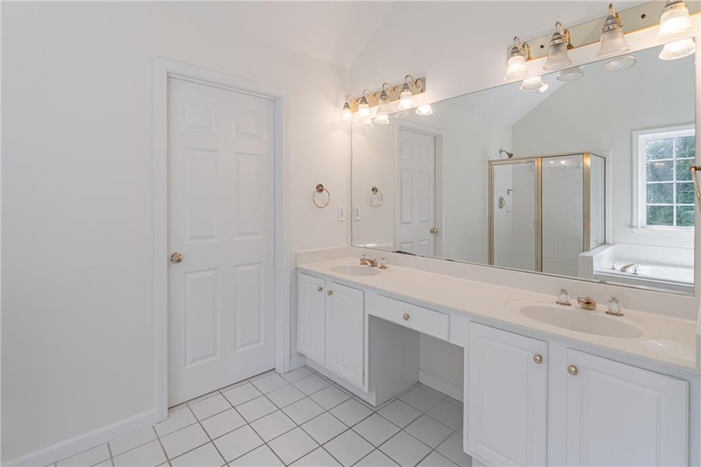 1324 Crescentwood Lane Decatur, GA 30032 - Photo 32 of 58 a spacious bathroom with a double vanity sink mirror and shower