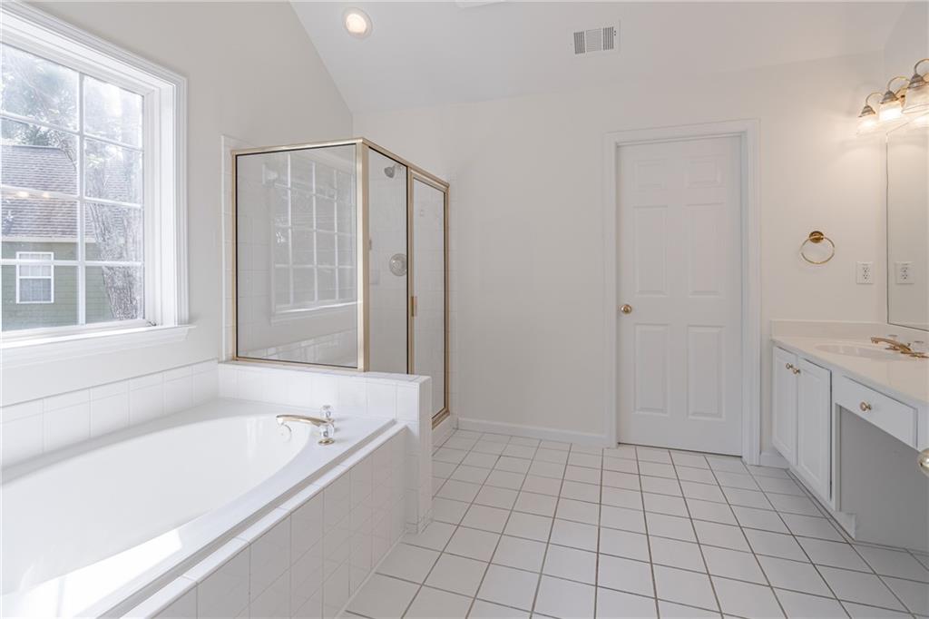 1324 Crescentwood Lane Decatur, GA 30032 - Photo 34 of 58 a spacious bathroom with a tub shower and sink
