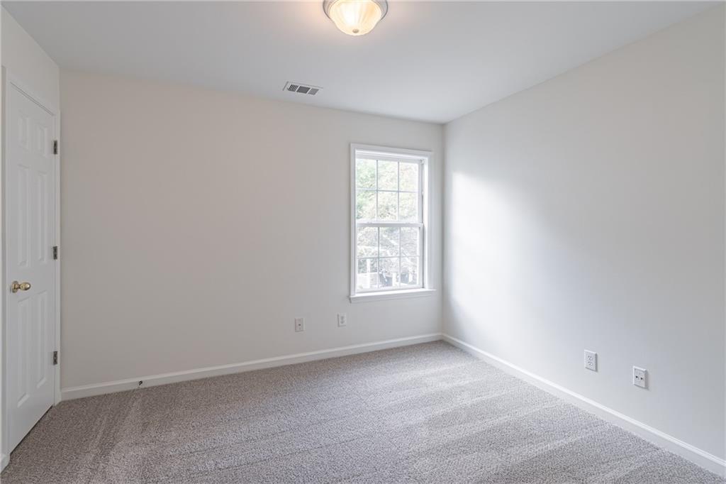 1324 Crescentwood Lane Decatur, GA 30032 - Photo 45 of 58 an empty room with windows