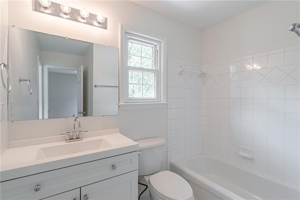 1324 Crescentwood Lane Decatur, GA 30032 - Photo 47 of 58 a bathroom with a sink toilet a mirror and shower