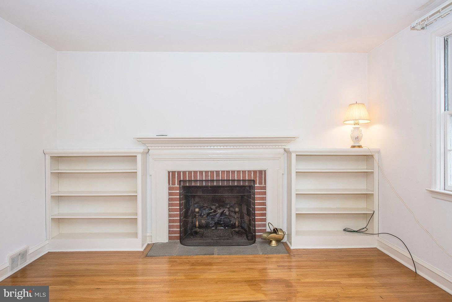 219 Wentworth Road Wayne, PA 19087 - Photo 6 of 32 Gas Fireplace with built-in shelves