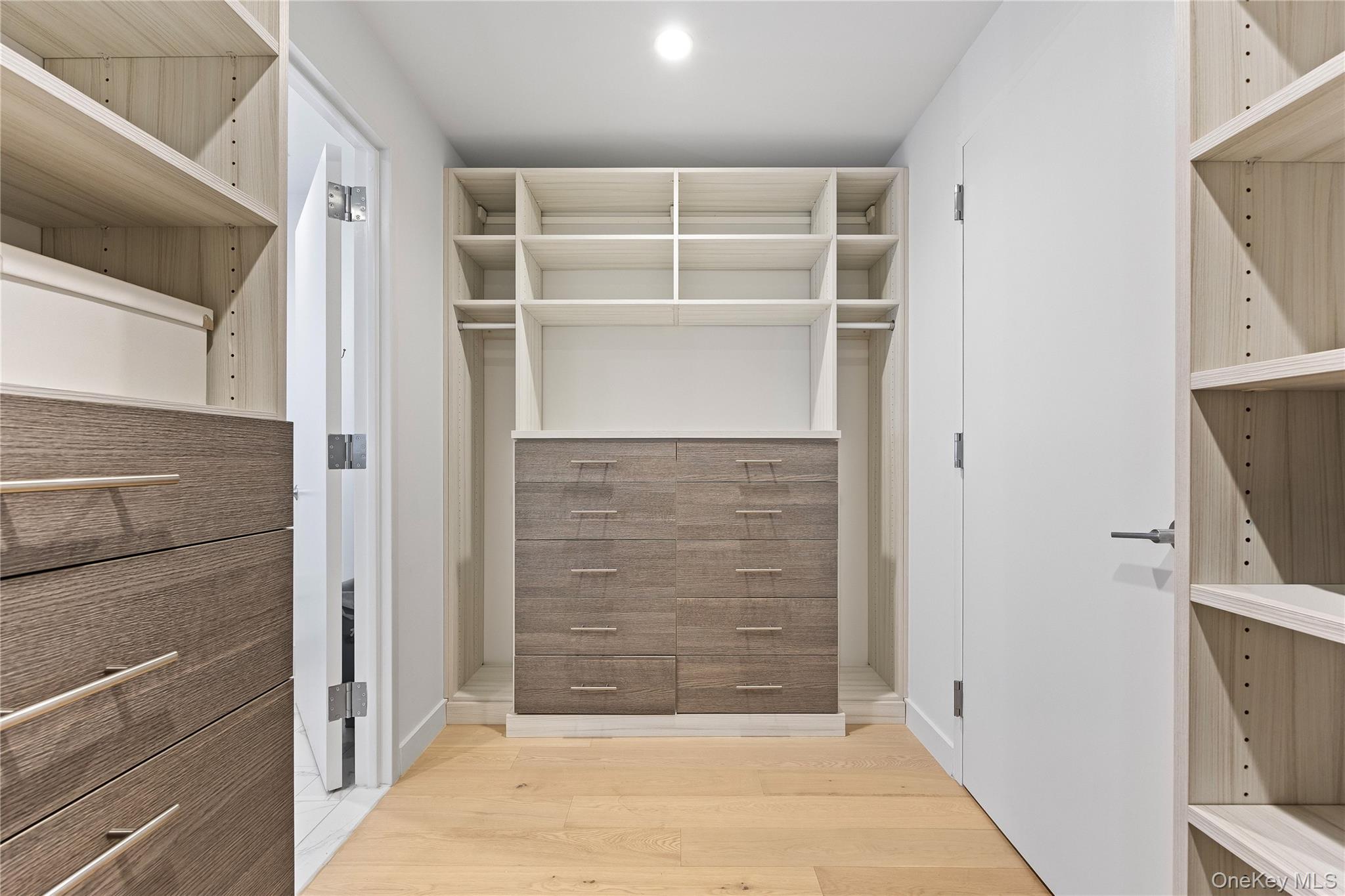 131-01 40 Road, Unit PH3F Queens, NY 11354 - Photo 22 of 30 a view of room with walk in closet and flat screen tv