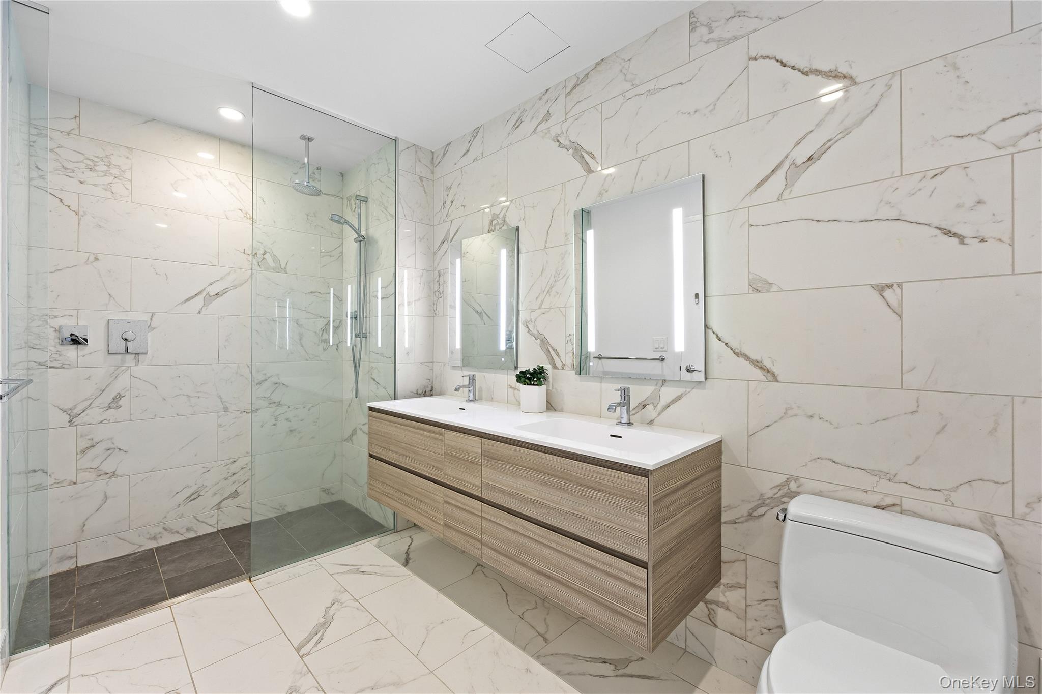 131-01 40 Road, Unit PH3F Queens, NY 11354 - Photo 23 of 30 a bathroom with a sink toilet and shower