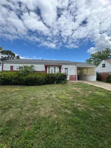 a view of a house with a back yard