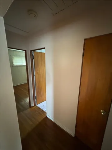 an empty room with wooden floor