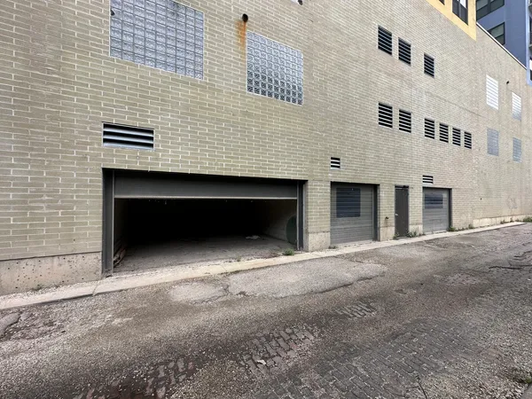 a front view of a building with a road