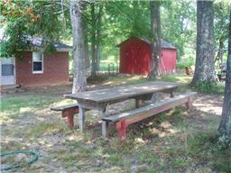 1245 Breeden Road Charlotte, TN 37036 - Photo 7 of 13 Back of the home. Large trees provide shade for your family gathering or picnic. This the perfect place for a family reunion.