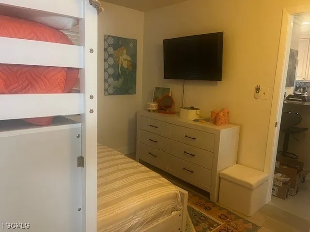 a view of a dresser and a flat screen tv