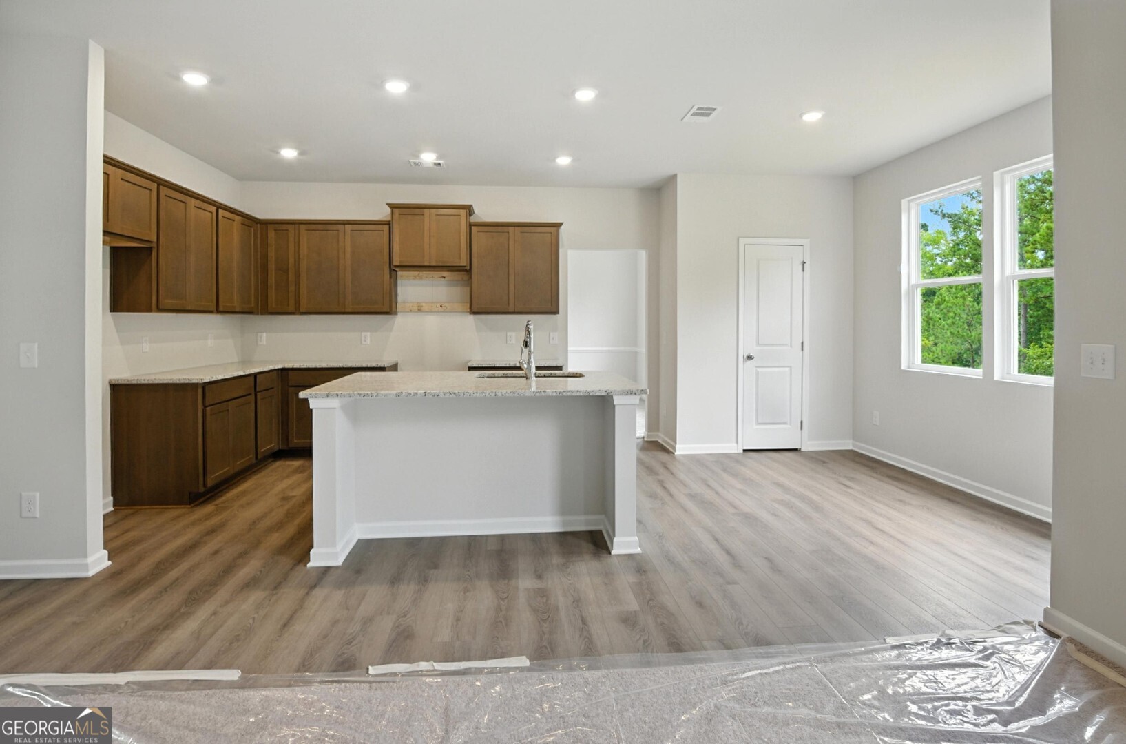 720 River Run Drive, Unit 45 Dallas, GA 30132 - Photo 12 of 53 a large kitchen with a sink and a large window