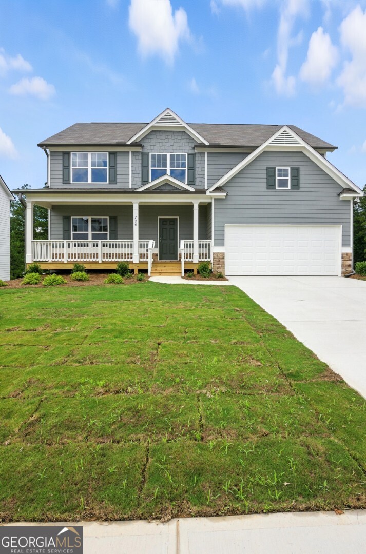 720 River Run Drive, Unit 45 Dallas, GA 30132 - Photo 3 of 53 a front view of a house with a garden