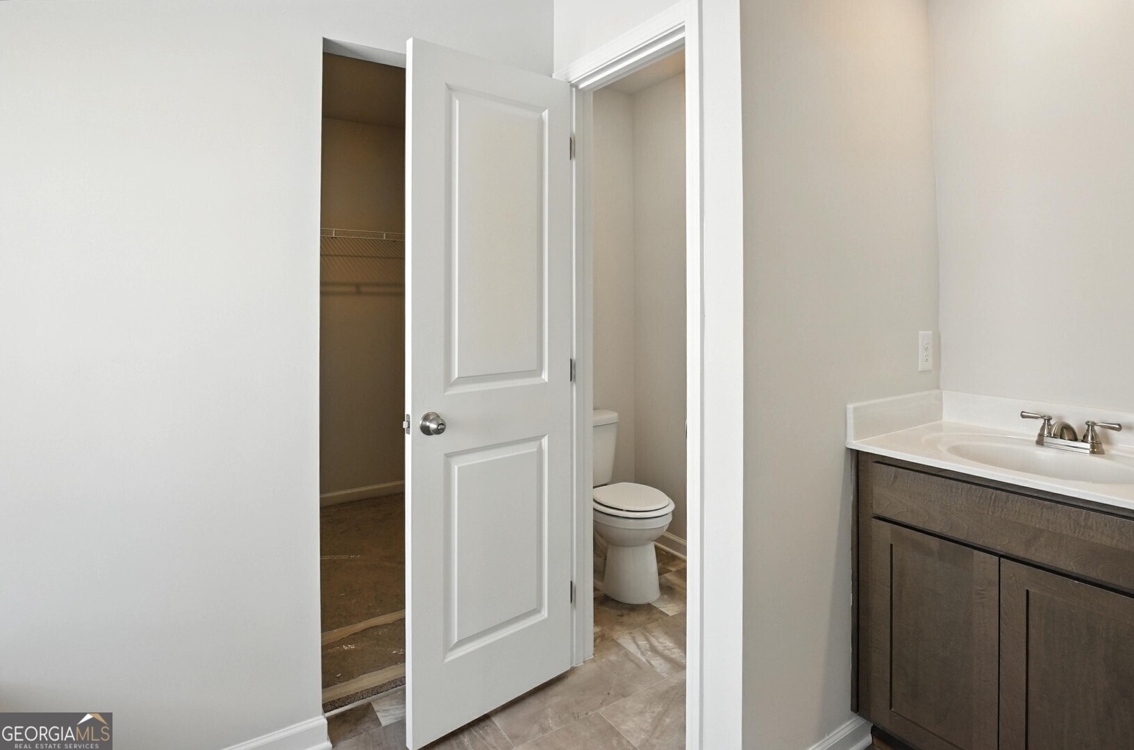 720 River Run Drive, Unit 45 Dallas, GA 30132 - Photo 37 of 53 a bathroom with a toilet a sink and mirror