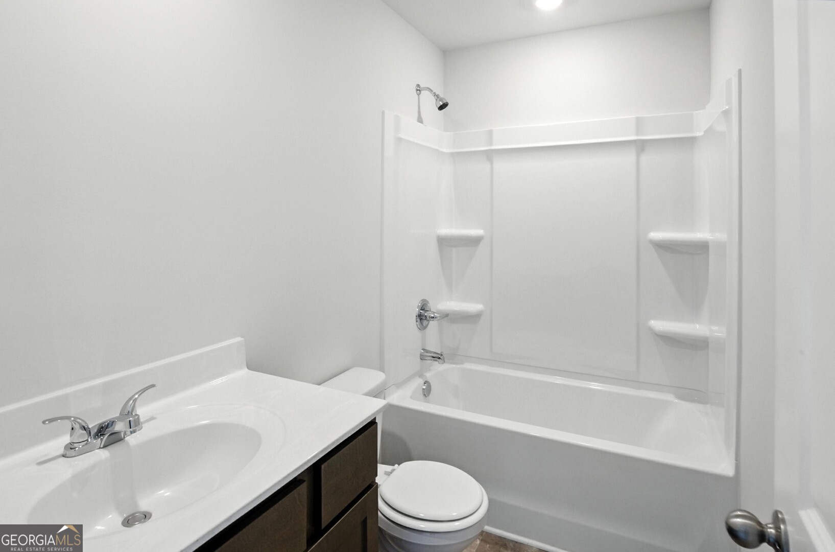 720 River Run Drive, Unit 45 Dallas, GA 30132 - Photo 51 of 53 a bathroom with a bathtub shower sink vanity mirror and toilet