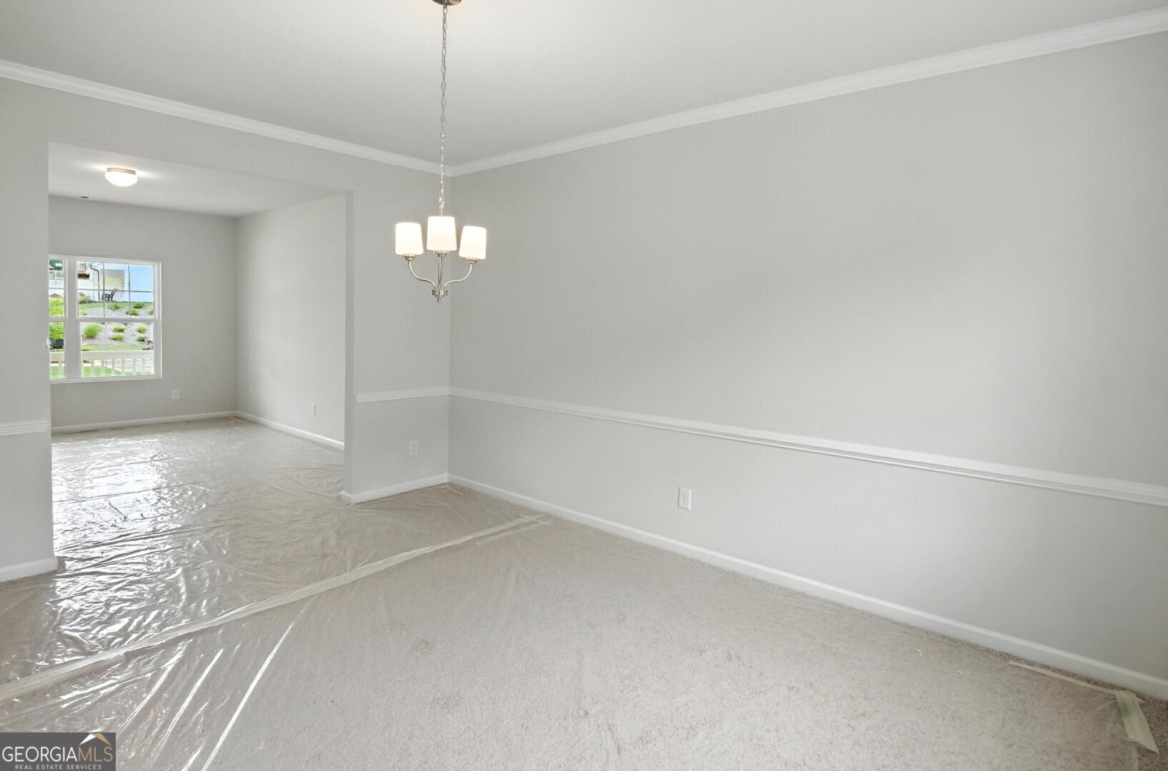 720 River Run Drive, Unit 45 Dallas, GA 30132 - Photo 8 of 53 a view of an empty room with window and chandelier fan