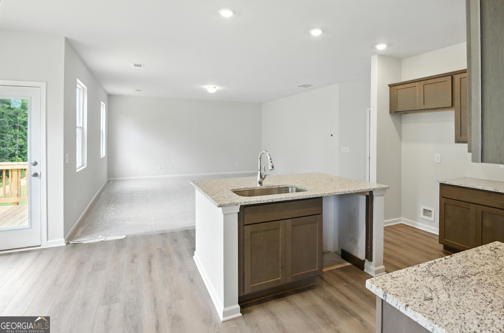 720 River Run Drive, Unit 45 Dallas, GA 30132 - Photo 10 of 53 a kitchen with a sink and a refrigerator