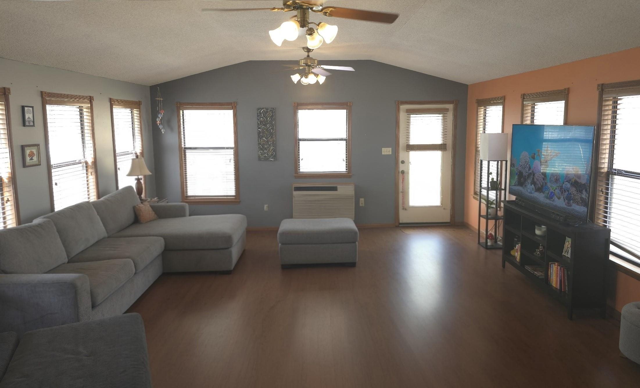8724 Fay Road Memphis, TN 38018 - Photo 11 of 26 Living room featuring wood finished floors, ceiling fan, and a textured ceiling