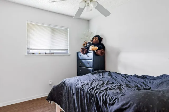 a bedroom with a bed and cabinets