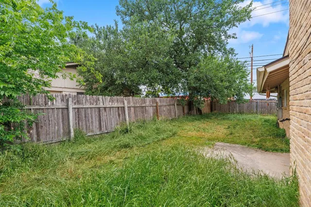 a view of a backyard with a trees