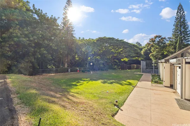 a view of a swimming pool with an outdoor space and seating area