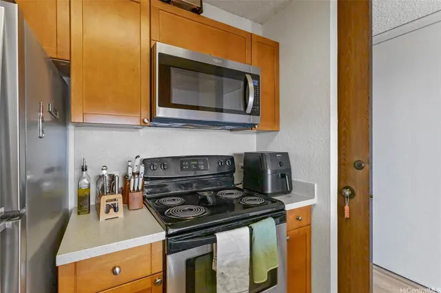 a kitchen with a stove and a microwave