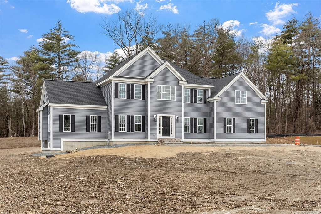 7 Robinson Road Pepperell, MA 01463 - Photo 1 of 30 a front view of a house with a yard