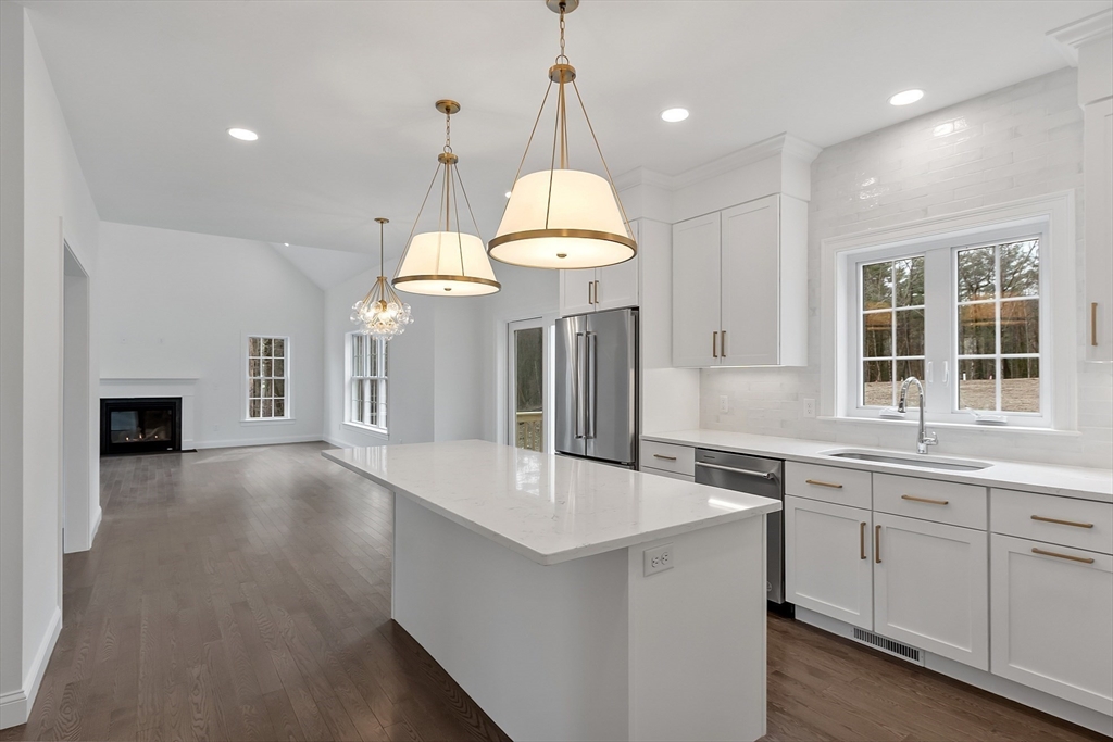 7 Robinson Road Pepperell, MA 01463 - Photo 18 of 30 a kitchen with center island and stainless steel appliances