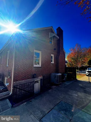 a view of a porch with furniture and a yard