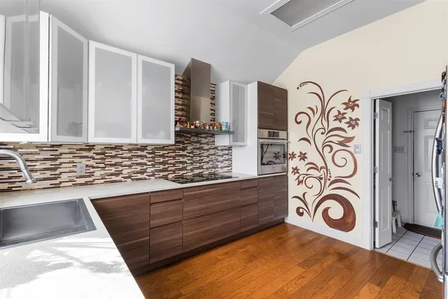 a bathroom with a mirror and a sink