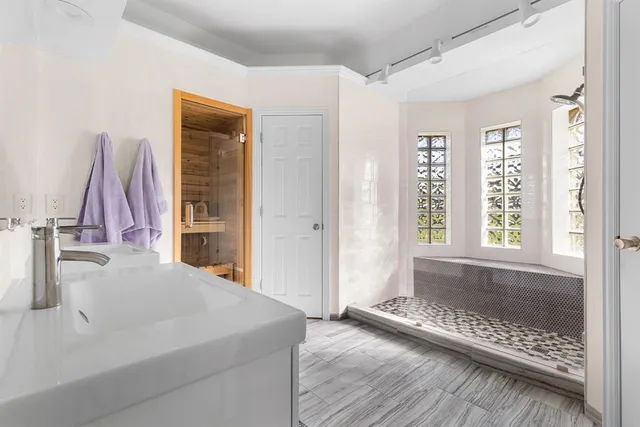 a bathroom with a tub and a sink