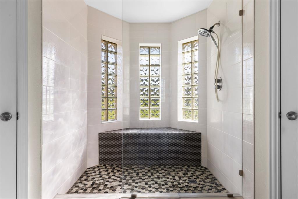 2609 Castle Road Burleson, TX 76028 - Photo 18 of 25 a bathroom with a window a shower and a window