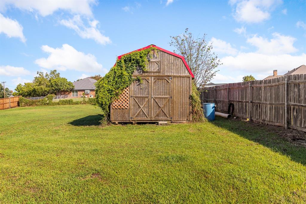 2609 Castle Road Burleson, TX 76028 - Photo 22 of 25 a view of a field with a small yard