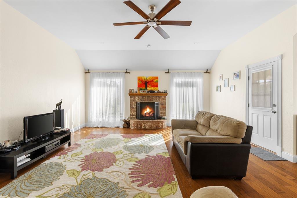 2609 Castle Road Burleson, TX 76028 - Photo 4 of 25 a living room with furniture and a flat screen tv