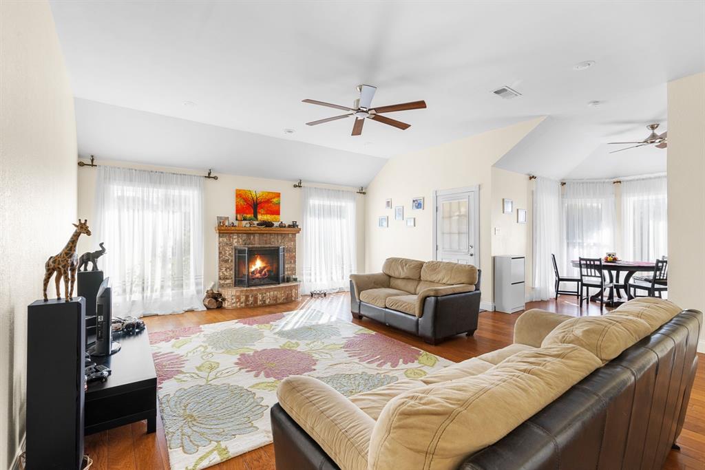 2609 Castle Road Burleson, TX 76028 - Photo 5 of 25 a living room with furniture and a fireplace