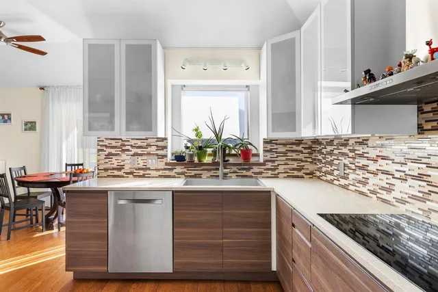 a kitchen with a sink and cabinets