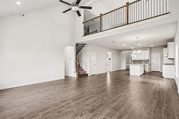 a view of a kitchen with wooden floor and a kitchen