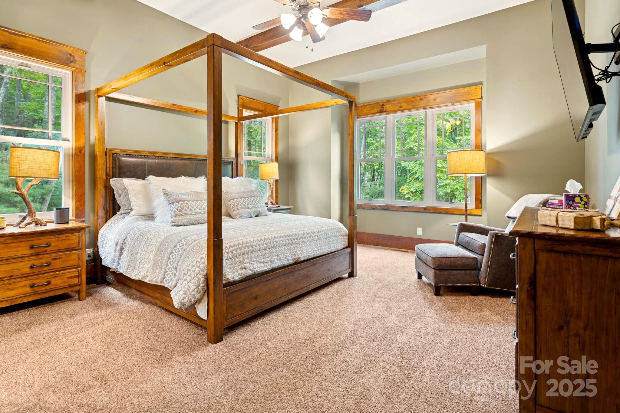 23 Dividing Ridge Trail Arden, NC 28704 - Photo 11 of 34 a bedroom with a bed and a couch next to a window