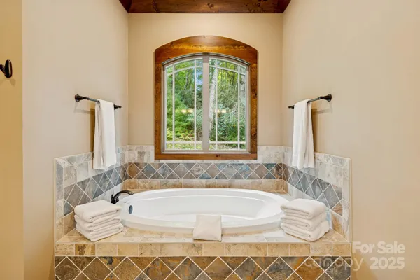 a bath tub sitting next to a window