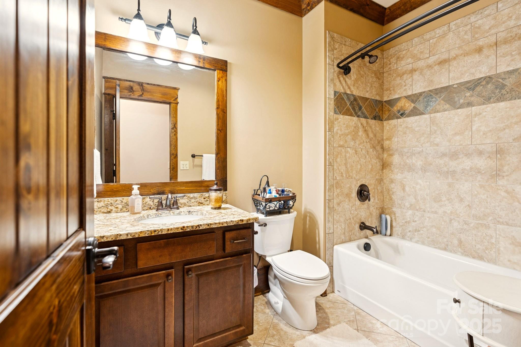 23 Dividing Ridge Trail Arden, NC 28704 - Photo 20 of 34 a bathroom with a granite countertop sink toilet and shower