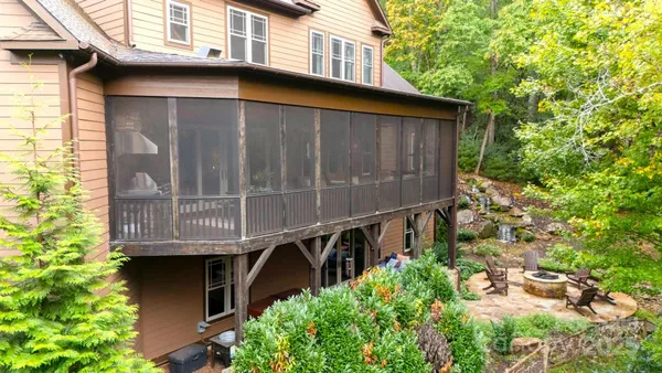 a backyard of a house with lots of green space and shower