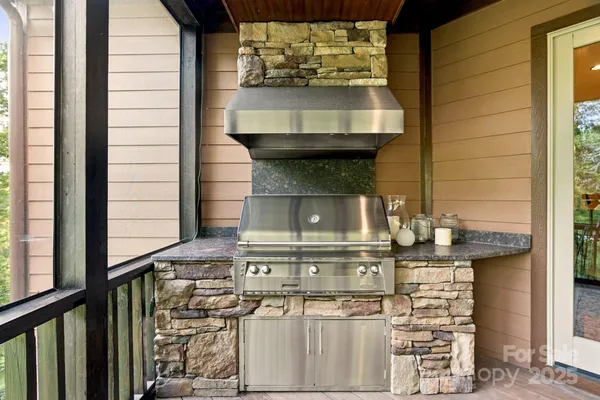 a stove top oven sitting inside of a kitchen