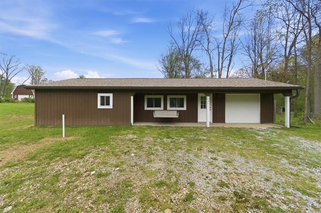 261 Hilltop Acres Road Slippery Rock, PA 16057 - Photo 2 of 35 a view of a house with a backyard