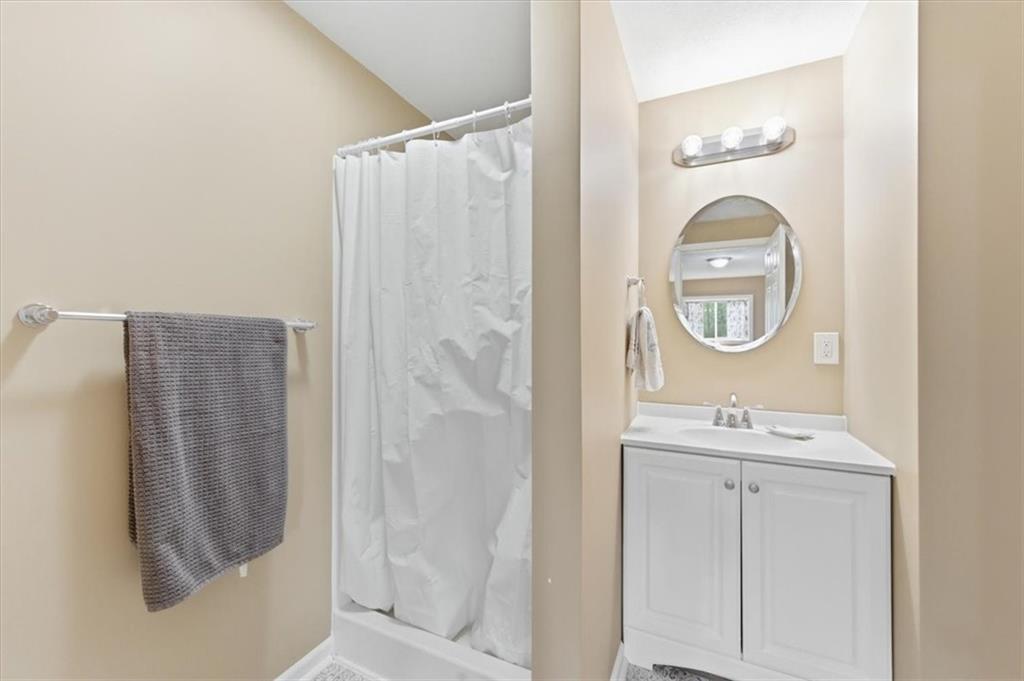261 Hilltop Acres Road Slippery Rock, PA 16057 - Photo 21 of 35 a bathroom with a sink a mirror a vanity and a shower