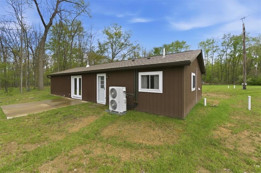 261 Hilltop Acres Road Slippery Rock, PA 16057 - Photo 23 of 35 a view of a house with backyard and garden