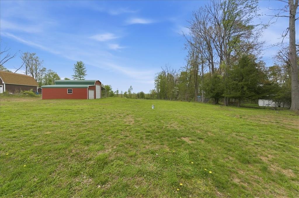 261 Hilltop Acres Road Slippery Rock, PA 16057 - Photo 26 of 35 a view of a field with an trees